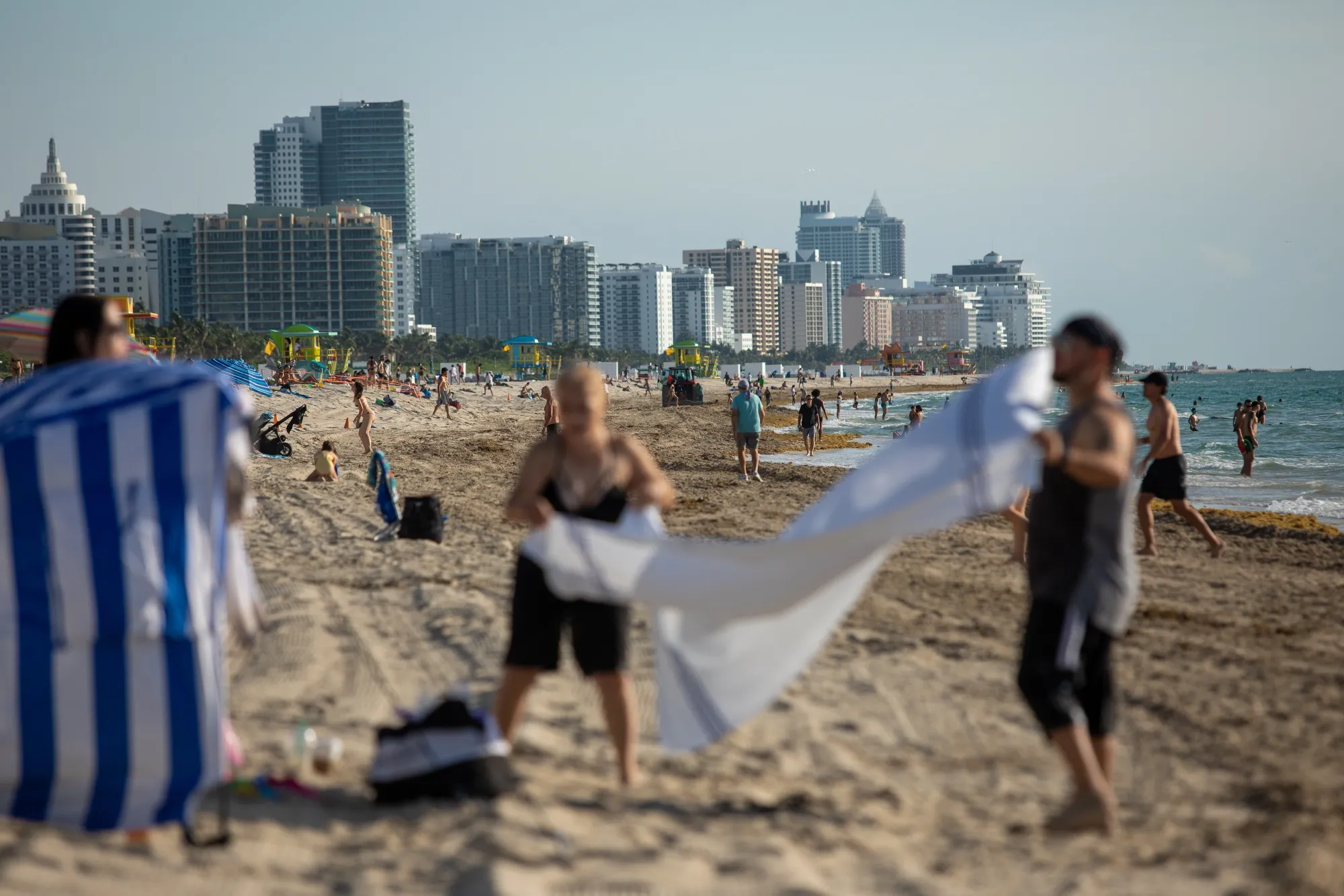 People walk along the beach in Miami Beach, Florida, U.S., on&nbsp;June 10.