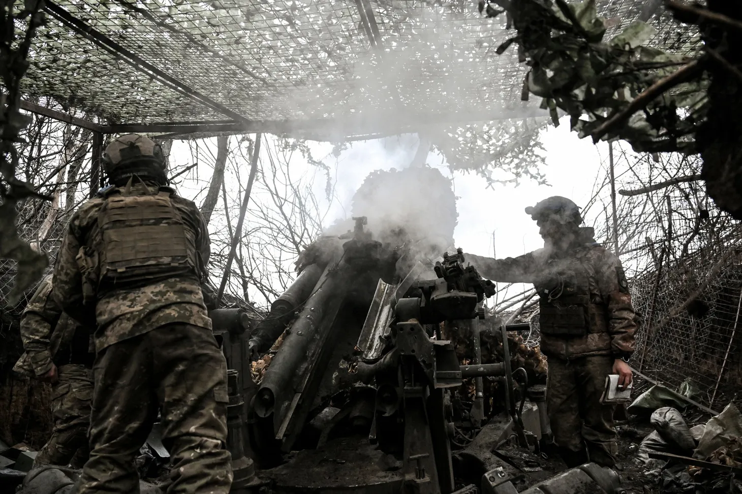 Soldiers man an M777 howitzer during a combat mission in the Dnipropetrovsk region, Ukraine, on Dec. 24.