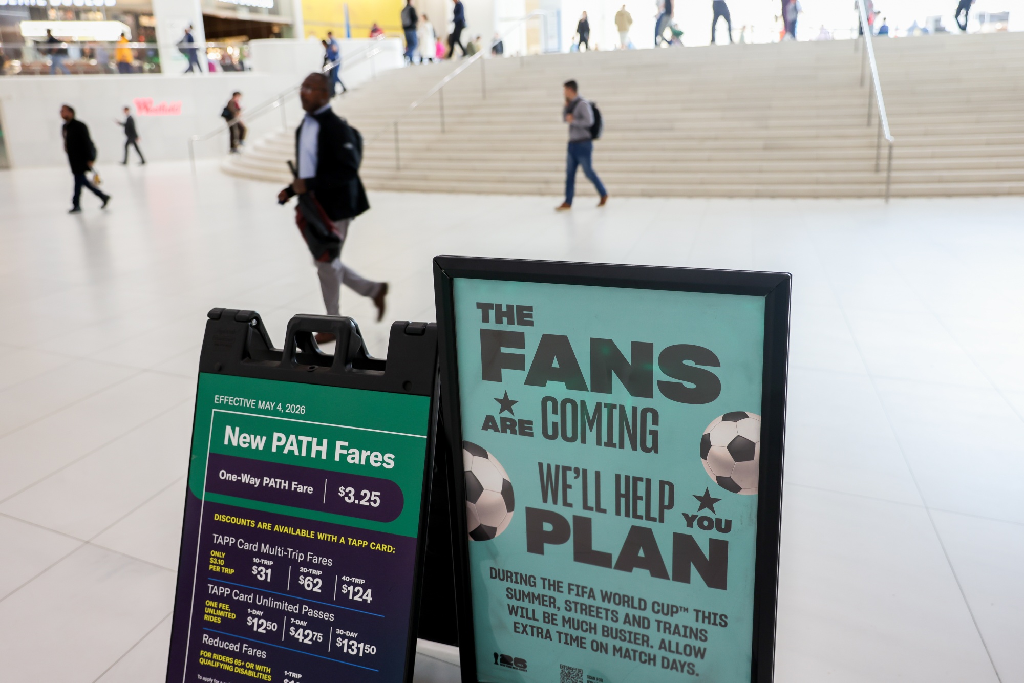 Signage for the FIFA World Cup at the World Trade Center PATH train station in New York, US, on Thursday, May 21, 2026. A thousand New Yorkers will win $50 tickets to the FIFA World Cup in June and July, giving them a way around sky-high prices that have stirred anger among soccer fans. Photographer: Michael Nagle/Bloomberg