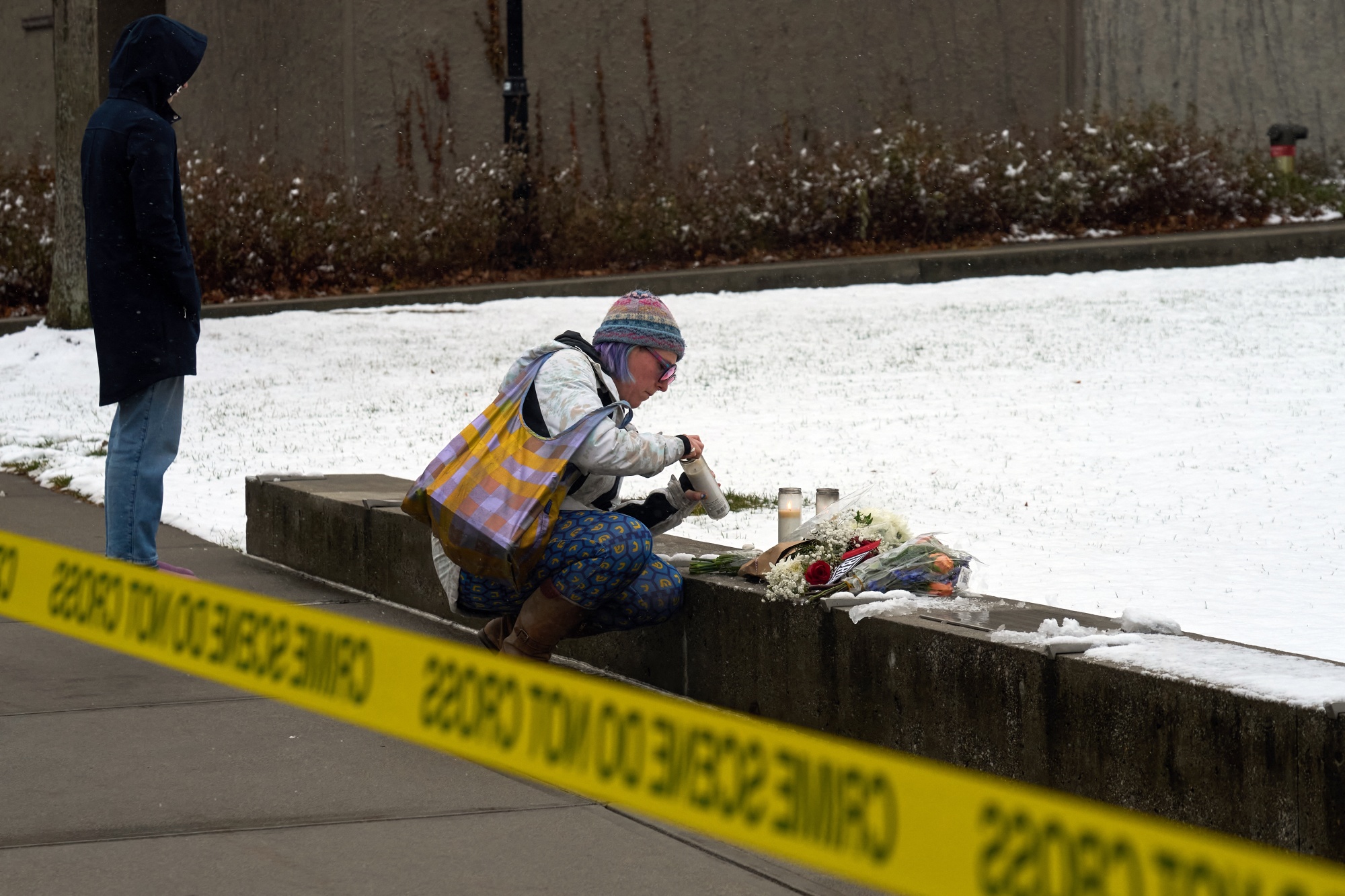A makeshift memorial outside the Barus &amp;amp; Holley engineering building on the campus of Brown University, in Providence, Rhode Island on Dec. 14, 2025. Photographer: Bing Guan/AFP/Getty Images