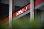 The Nomura Holdings Inc. logo is displayed outside a Nomura Securities Co. branch in Tokyo, Japan