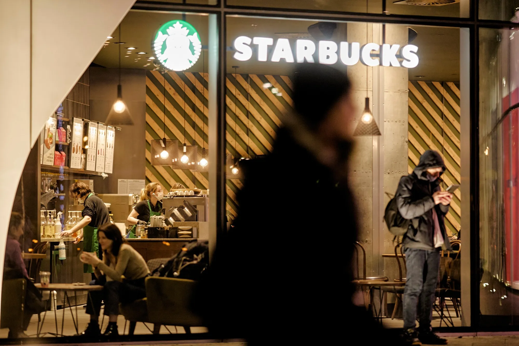 Starbucks broke federal labor law when it boosted wages and benefits only for workers in non-unionized stores across the US last year, a National Labor Relations Board judge held.