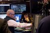 Traders work on the floor of the New York Stock Exchange (NYSE) in New York, U.S..