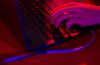 Red light illuminates the keys of a laptop computer at the Dreamhack digital festival in Moscow, Russia, on Saturday, Dec. 5, 2015. Dreamhack is the world\'s largest digital festival and meeting place for gamers, fans and e-sport enthusiasts.