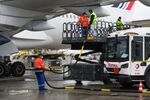 Workers fill an Airbus A350 passenger plane with sustainable aviation fuel (SAF) &nbsp;at Charles de Gaulle airport in Roissy, on May 18.