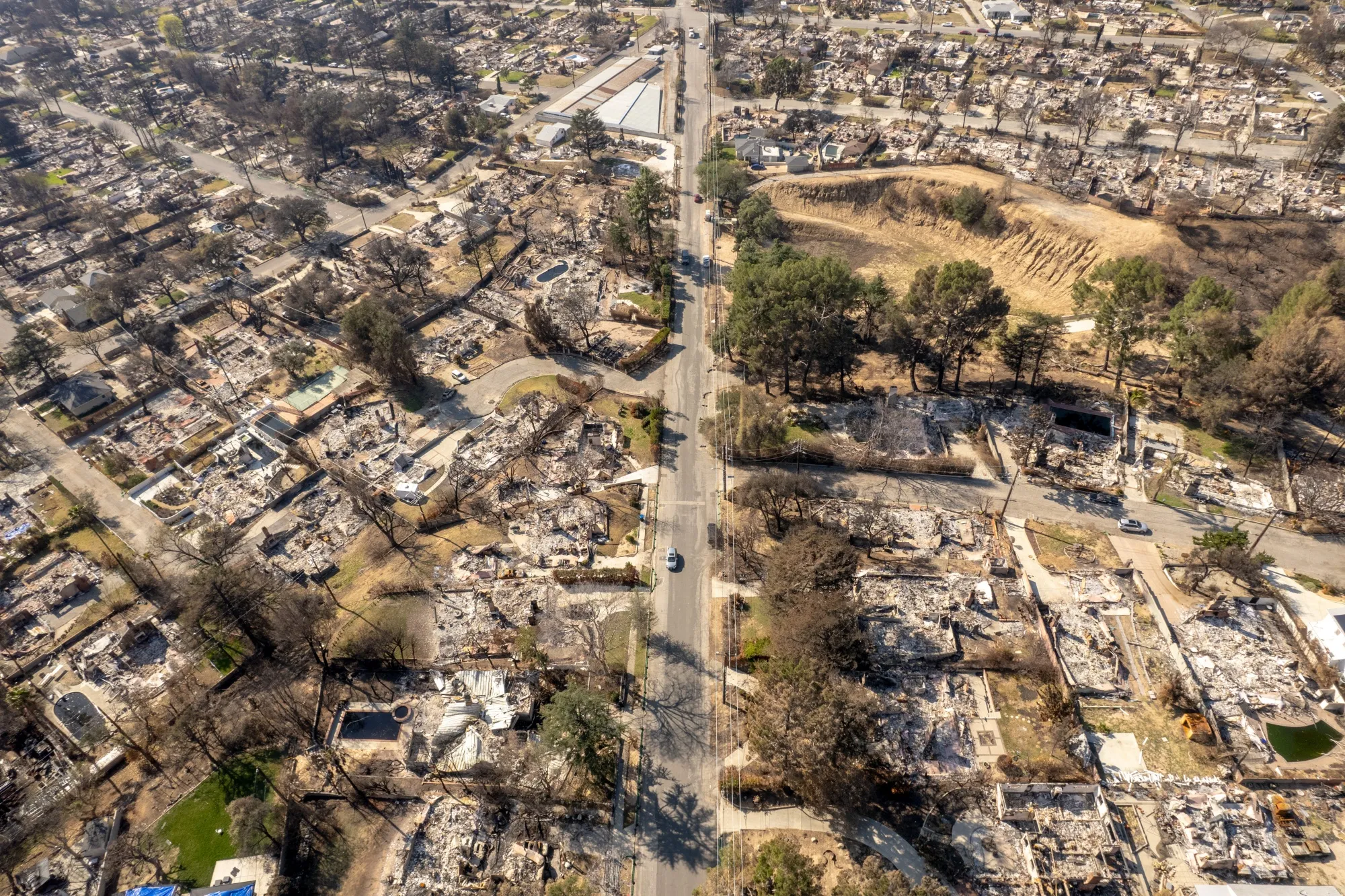 Homes destroyed following wildfires in Altadena, California, US.