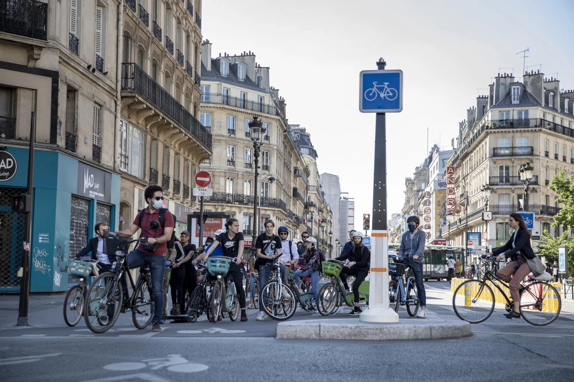 Cyclists wait to cross a road junction from a newly created bike only lane on Rue de Rivoli in Paris, France, on&nbsp;May 18.