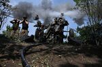 Ukrainian gunmen fire a US made M777 howitzer from their position on the front line in Kharkiv region, Ukraine, on Aug. 1.