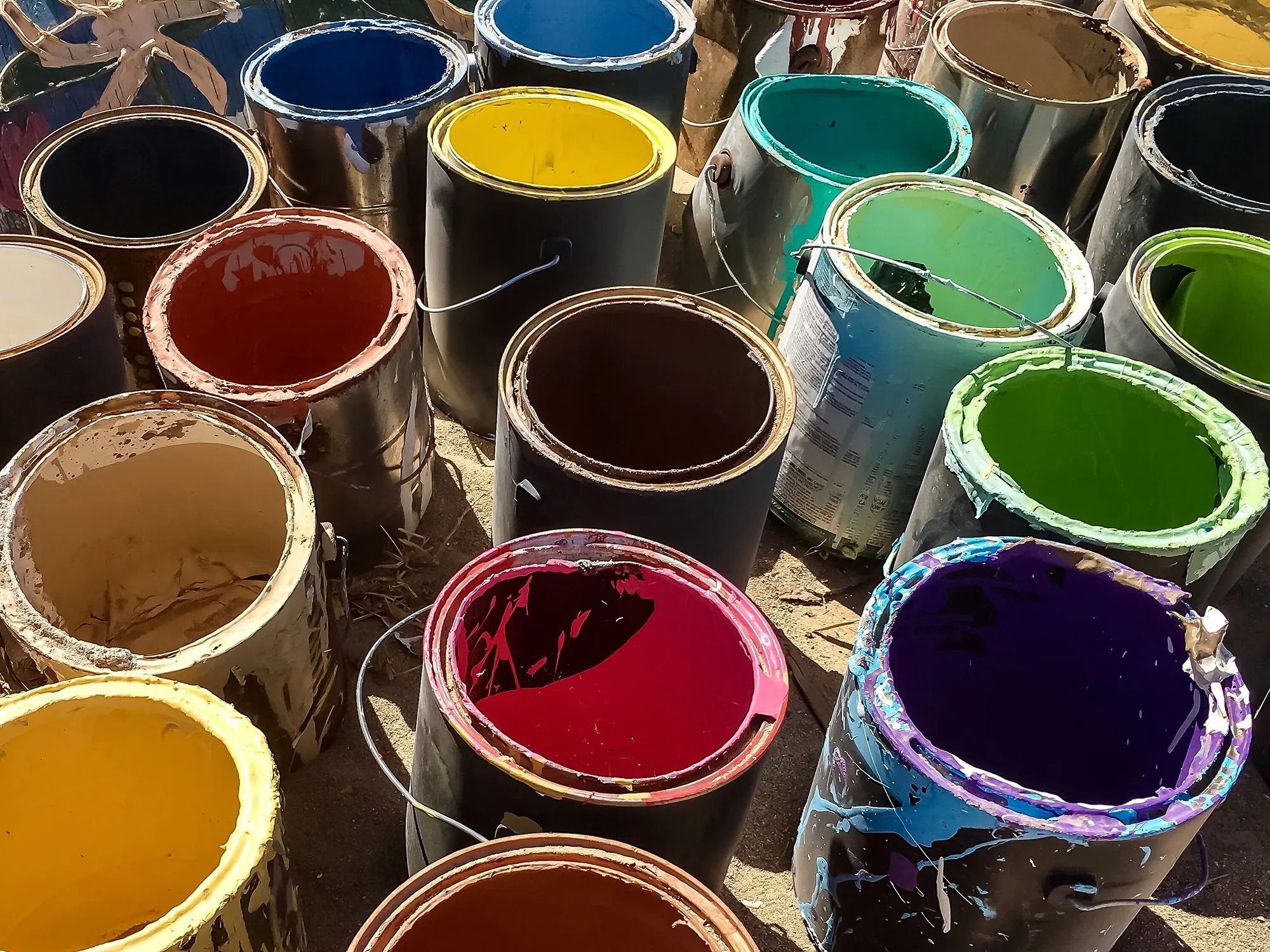 High Angle View Of Multi Colored Paint Cans