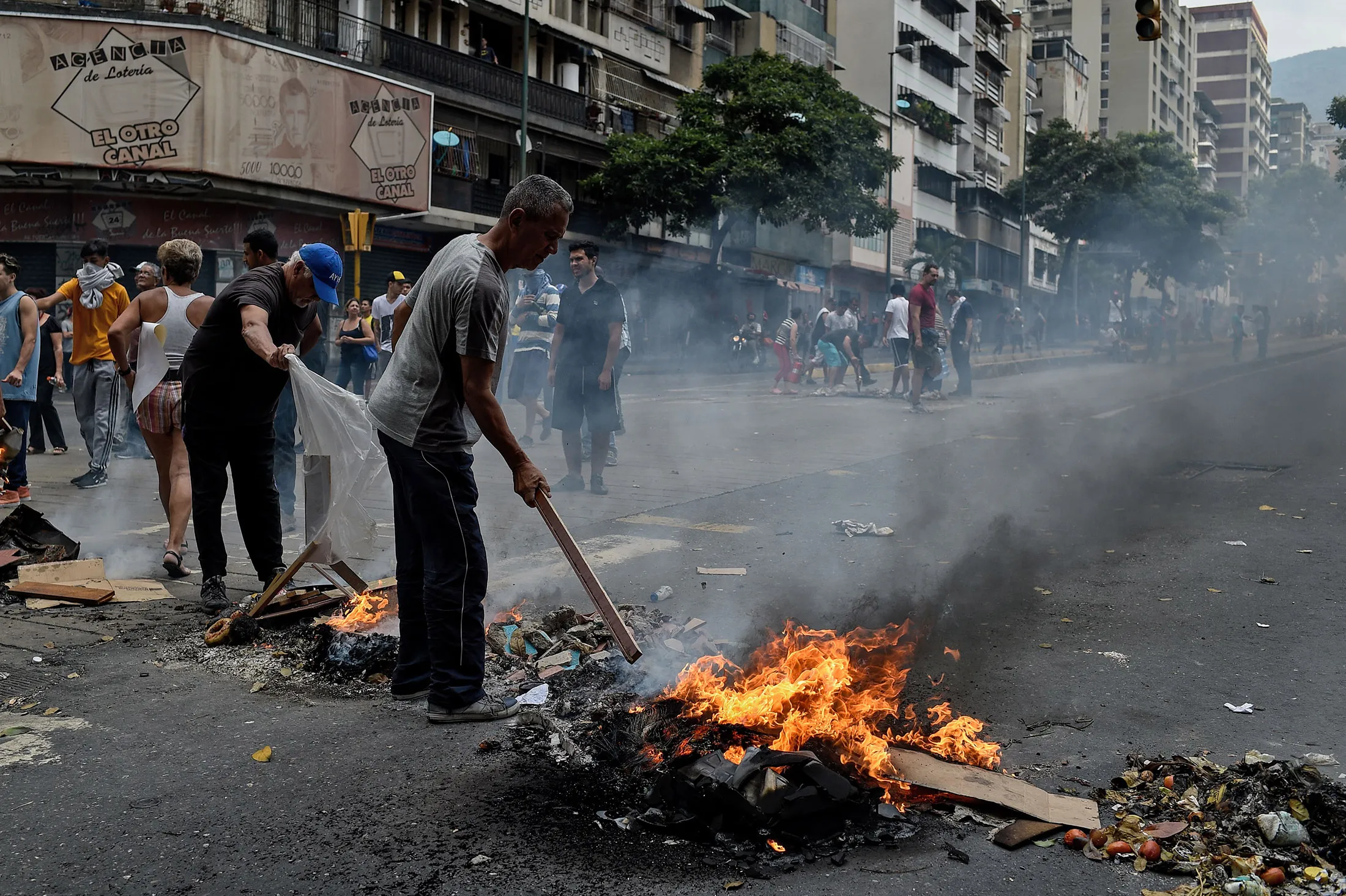People protest for the lack of water and electric service on March 31.