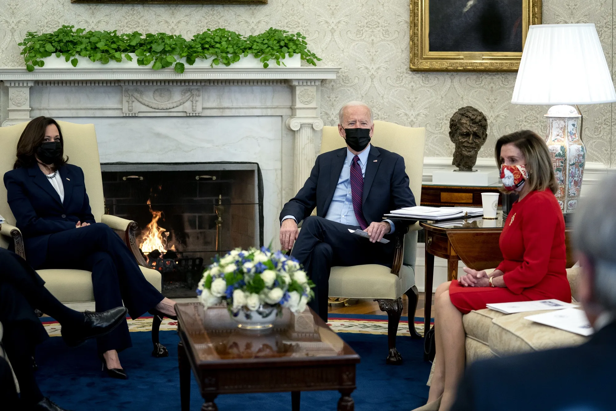 Joe Biden, center, =Kamala Harris, left, and Nancy Pelosi, meet in the Oval Office of the White House on Feb. 5.