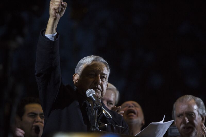 Andres Manuel Lopez Obrador, president of the left-wing political party National Regeneration Movement (MORENA), appears on stage during an event in Los Angeles, California, U.S., on Sunday, Feb. 12, 2017. The politician known locally as Amlo is the early frontrunner in Mexico's 2018 presidential race. Amid a spasm of national rage, voters are increasingly sympathetic to the cries of a radical outsider who promises to end a relationship of "subordination" to the U.S. and rebuild the domestic economy. Photographer: Dania Maxwell/Bloomberg