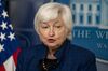 Close-up of Janet Yellen speaking on the podium at a press conference at the White House in briefing room