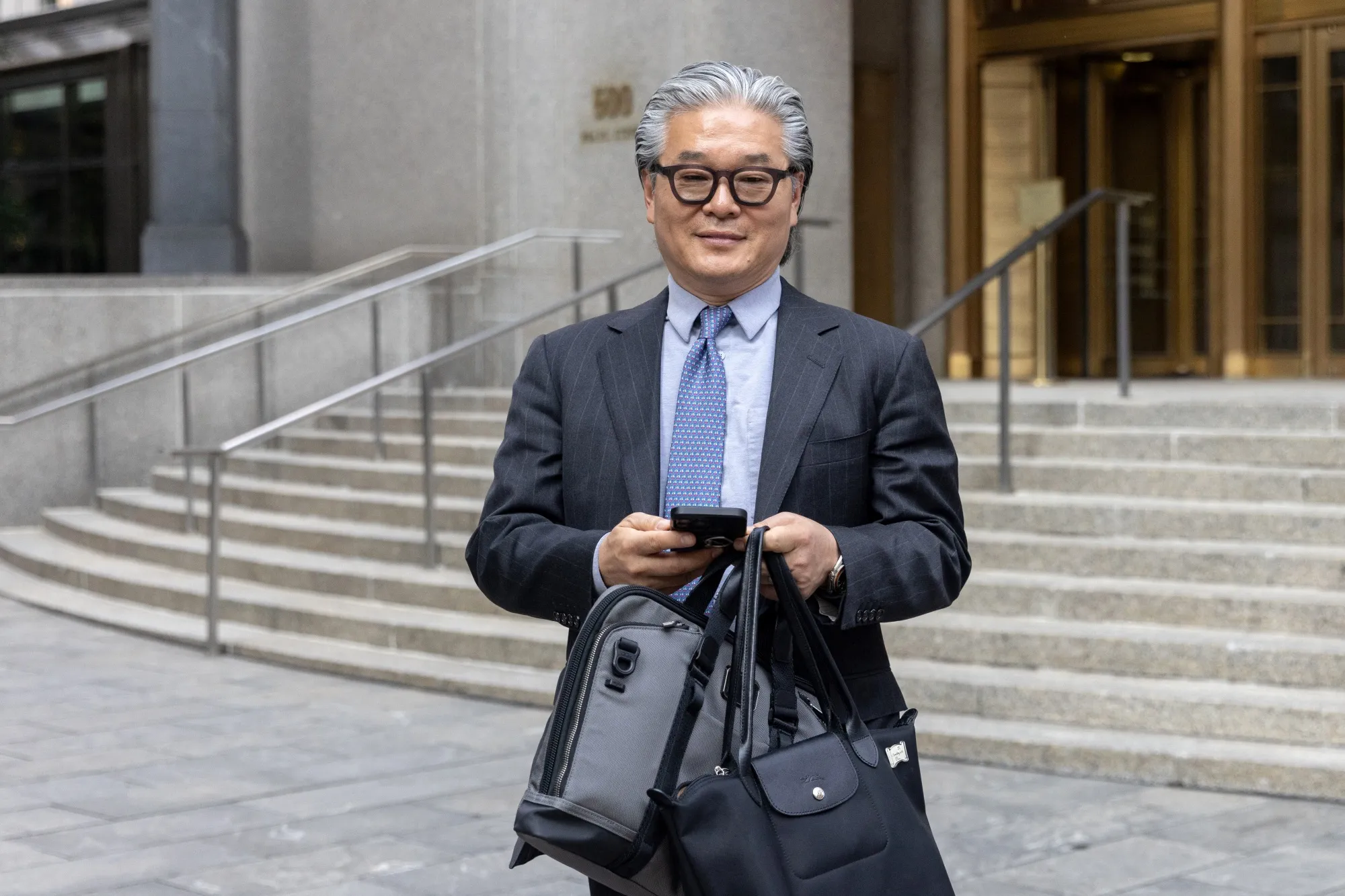 Bill Hwang exits federal court in New York on July 8.