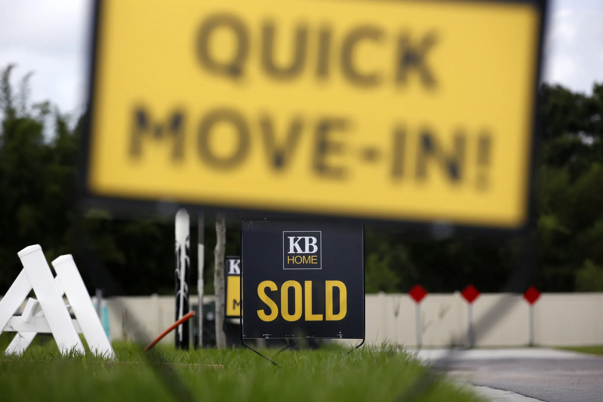 Sold sale signs outside houses under construction at in Florida.