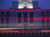 The Marriner S. Eccles Federal Reserve building stands past passing vehicles in Washington, D.C.