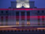 The Marriner S. Eccles Federal Reserve building stands past passing vehicles in Washington, D.C.