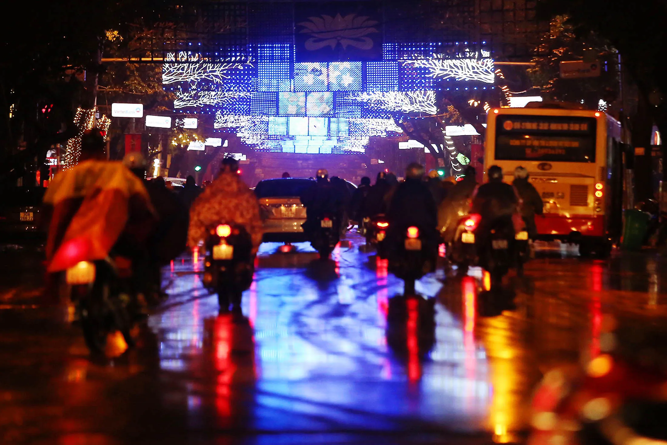 Traffic travels along Tran Phu street illuminated at night in Hanoi, Vietnam, on Tuesday, Jan. 26, 2016. Vietnam's new leadership is starting to take shape after days of behind-the-scenes sparring at a Communist Party congress, with the biggest beneficiary the General Secretary Nguyen Phu Trong, potentially signaling a more cautious approach to economic reform.
