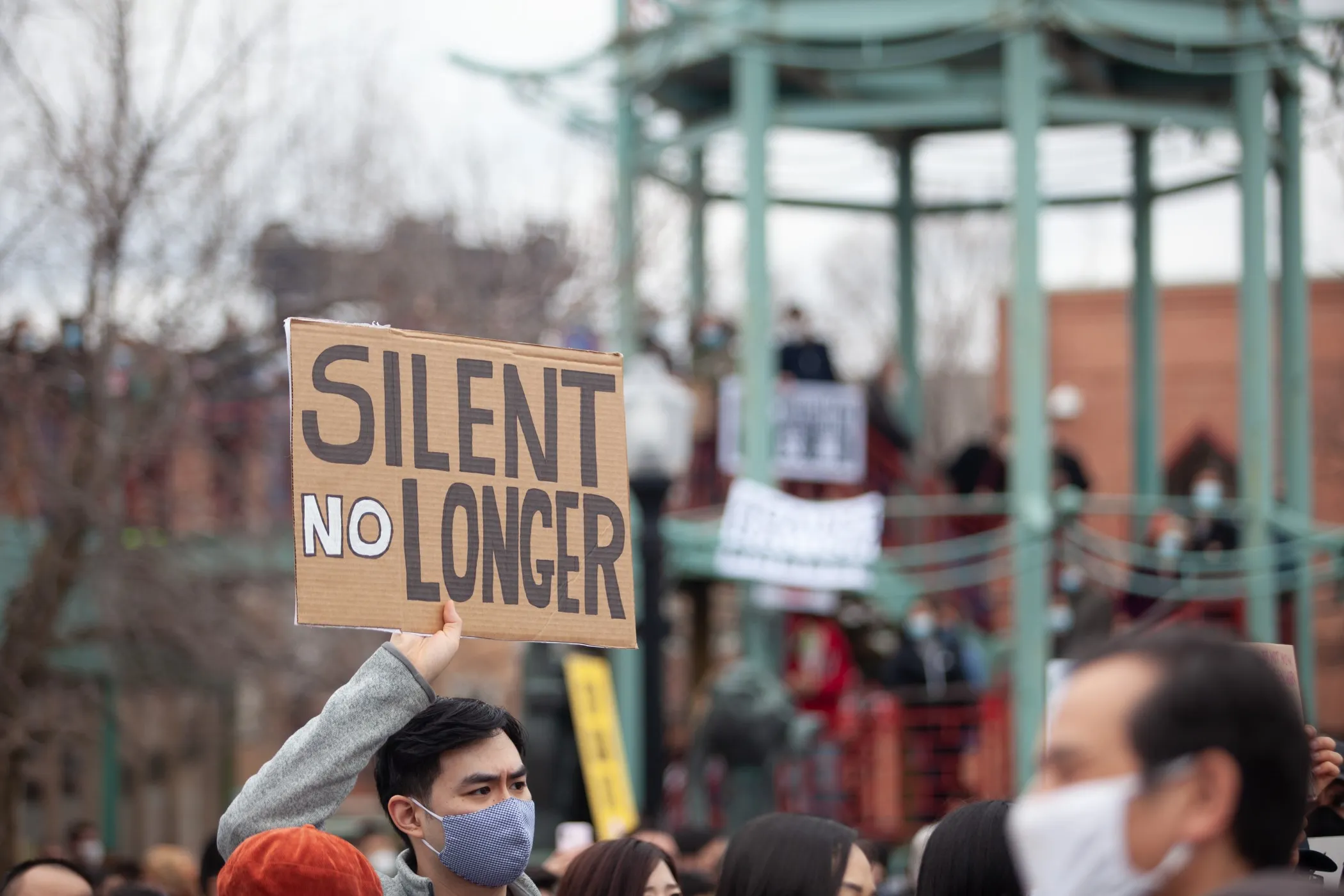 People holding signs take part in a Stop Asian Hate rally in Chicago’s Chinatown on March 27, 2021. A new Illinois law requires schools to teach about the contributions of Asian Americans toward advancing civil rights.