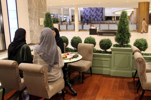Saudi women wear colored abayas while lunching in Centria Mall in Riyadh on Aug. 23.