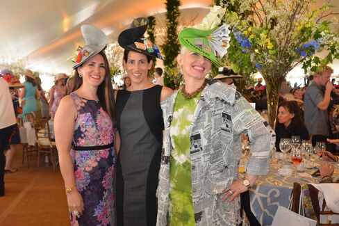 Sarah Kurita, Lara Marcon and Amy Tarr dressed as the different kinds of receptacles in Central Park: bottles and cans, trash, and newspapers and magazines. Photographer: Amanda Gordon/Bloomberg