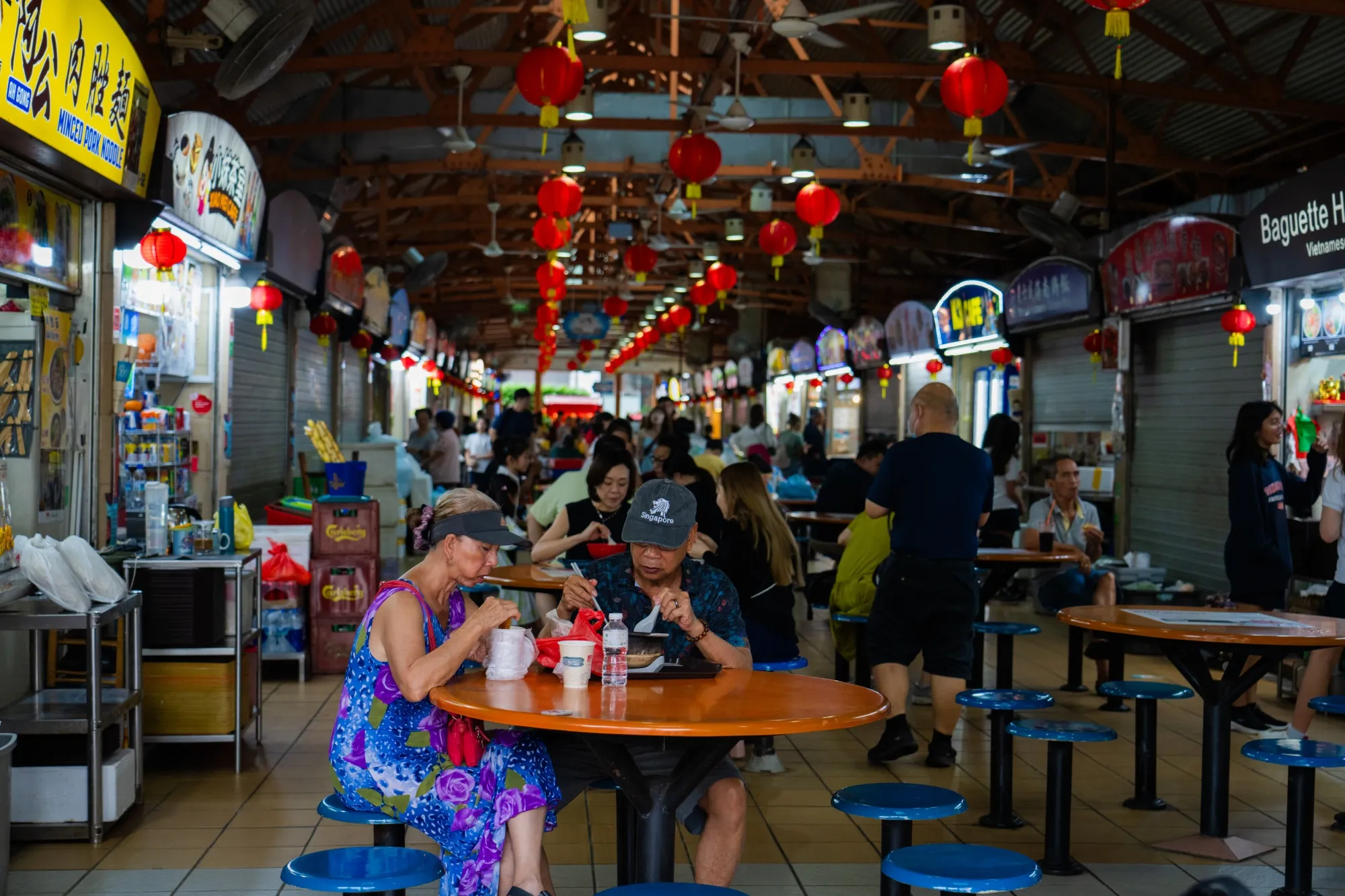 Sharing a table at one of Singapore’s hawker restaurant centers.