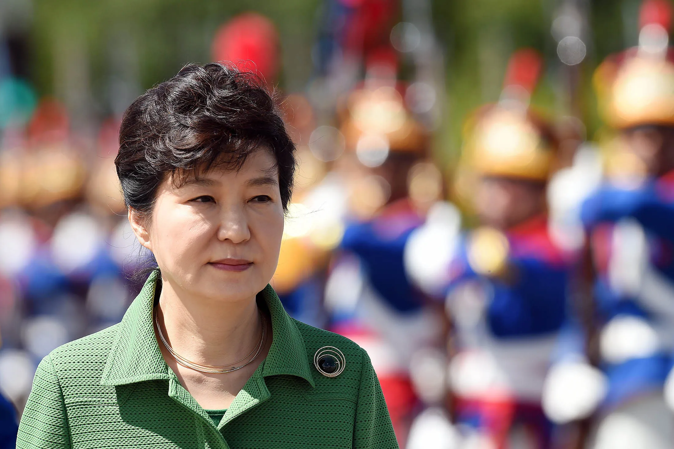 South Korean President Park Geun-hye reviews an honor guard as she arrives to meet Brazilian President Dilma Rousseff.

