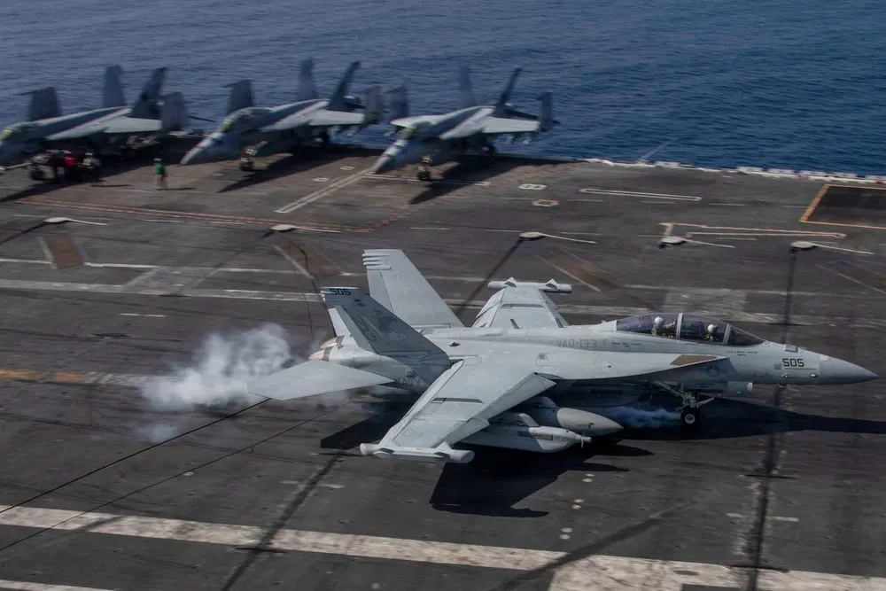 A US Navy fighter jet lands on the USS Abraham Lincoln aircraft carrier on Jan. 24.