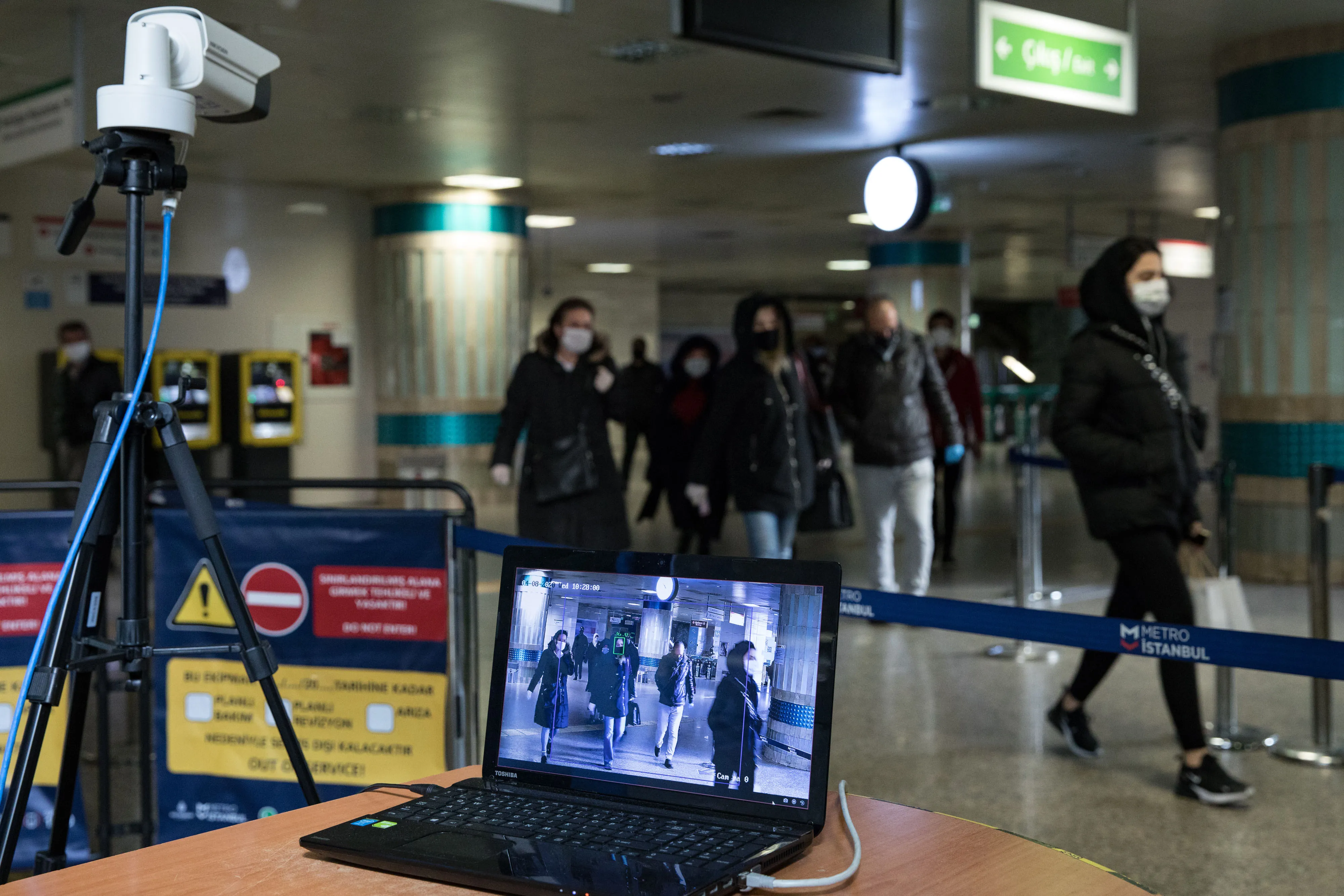 A thermal camera monitors passing travelers at a fever checkpoint in a Metro Istanbul station in Istanbul on April 8.