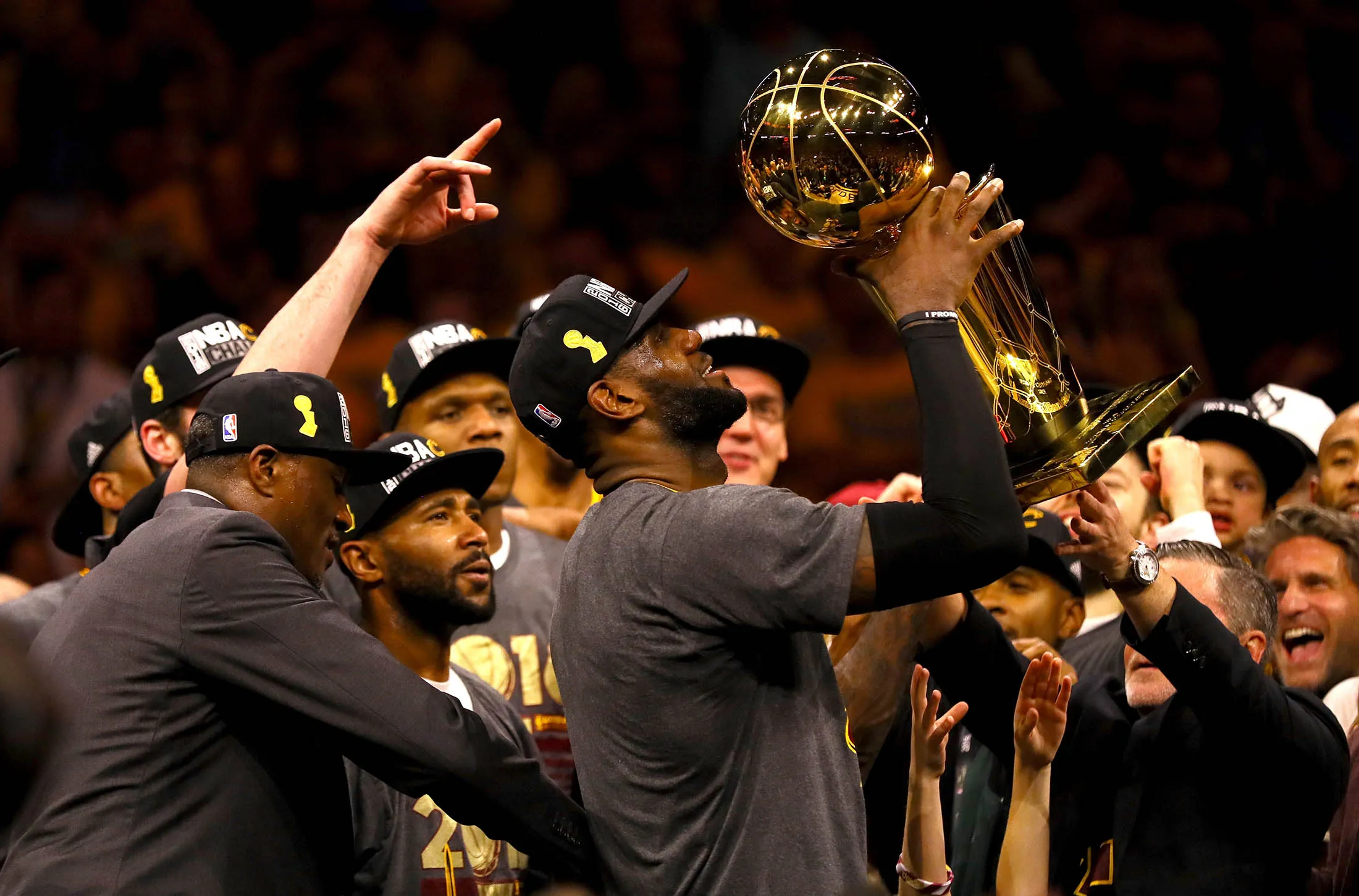 LeBron James of the Cleveland Cavaliers holds the Larry O'Brien Championship Trophy after defeating the Golden State Warriors 93-89 in Game 7 of the 2016 NBA Finals at Orcale Arena on June 19.
