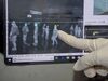 An Indonesian health officer points at the screen of a thermal scanner for passengers amid a deadly virus outbreak which began in the Chinese city of Wuhan.