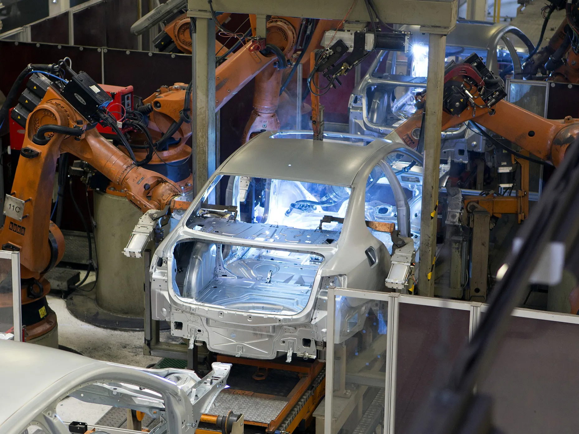 Welding robots work on vehicles at the Volkswagen AG assembly plant in Puebla, Mexico.