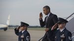US President Barack Obama salutes as he walks off Air Force One at Andrews Air Force Base in Maryland on May 20, 2015 after returning from the134th Commencement Exercises of the United States Coast Guard Academy in New London London, Connecticut, and a fundraiser in nearby Stamford .

