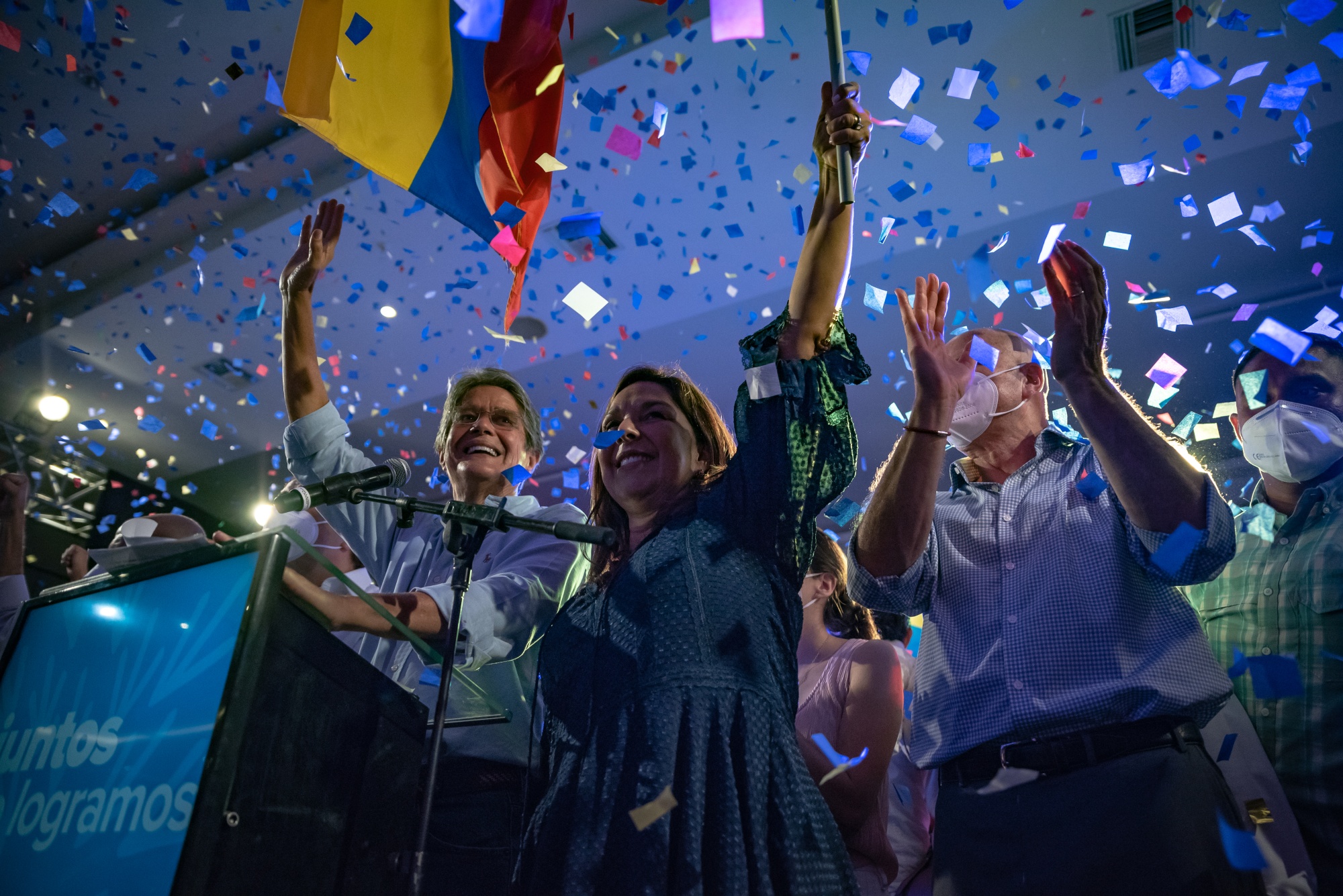 Guillermo Lasso, left, celebrates with his family and supporters in Guayaquil, Ecuador, on April 11.