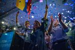 Guillermo Lasso, left, celebrates with his family and supporters in Guayaquil, Ecuador, on April 11.