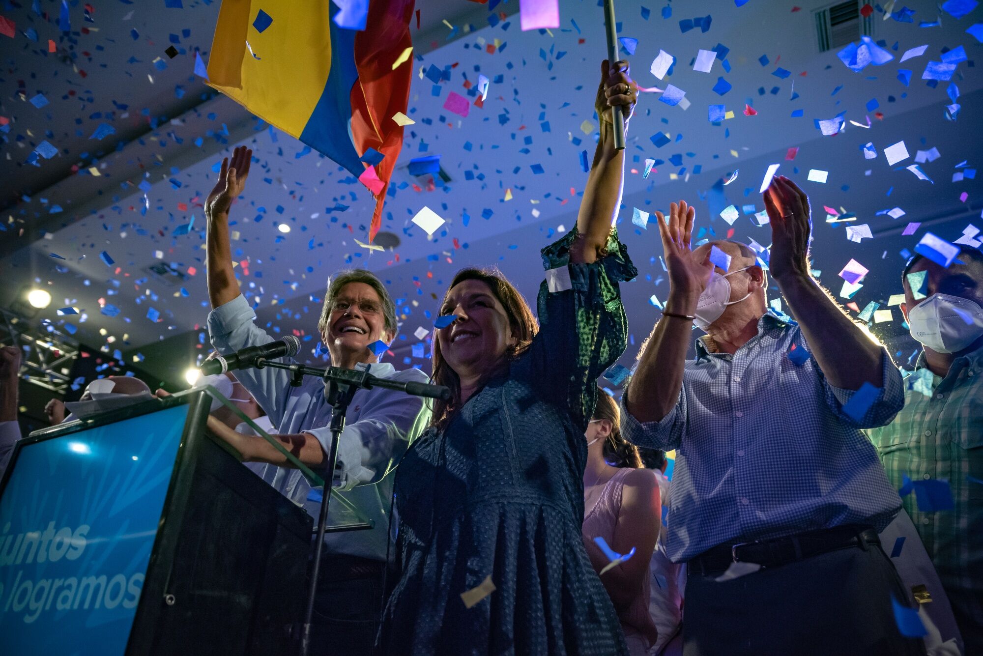 Guillermo Lasso, left, celebrates with his family and supporters in Guayaquil, Ecuador, on April 11.