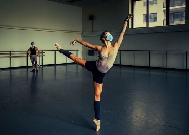 Phelan, a soloist at the ballet, rehearses while Danchig-Waring, a principal, looks on.