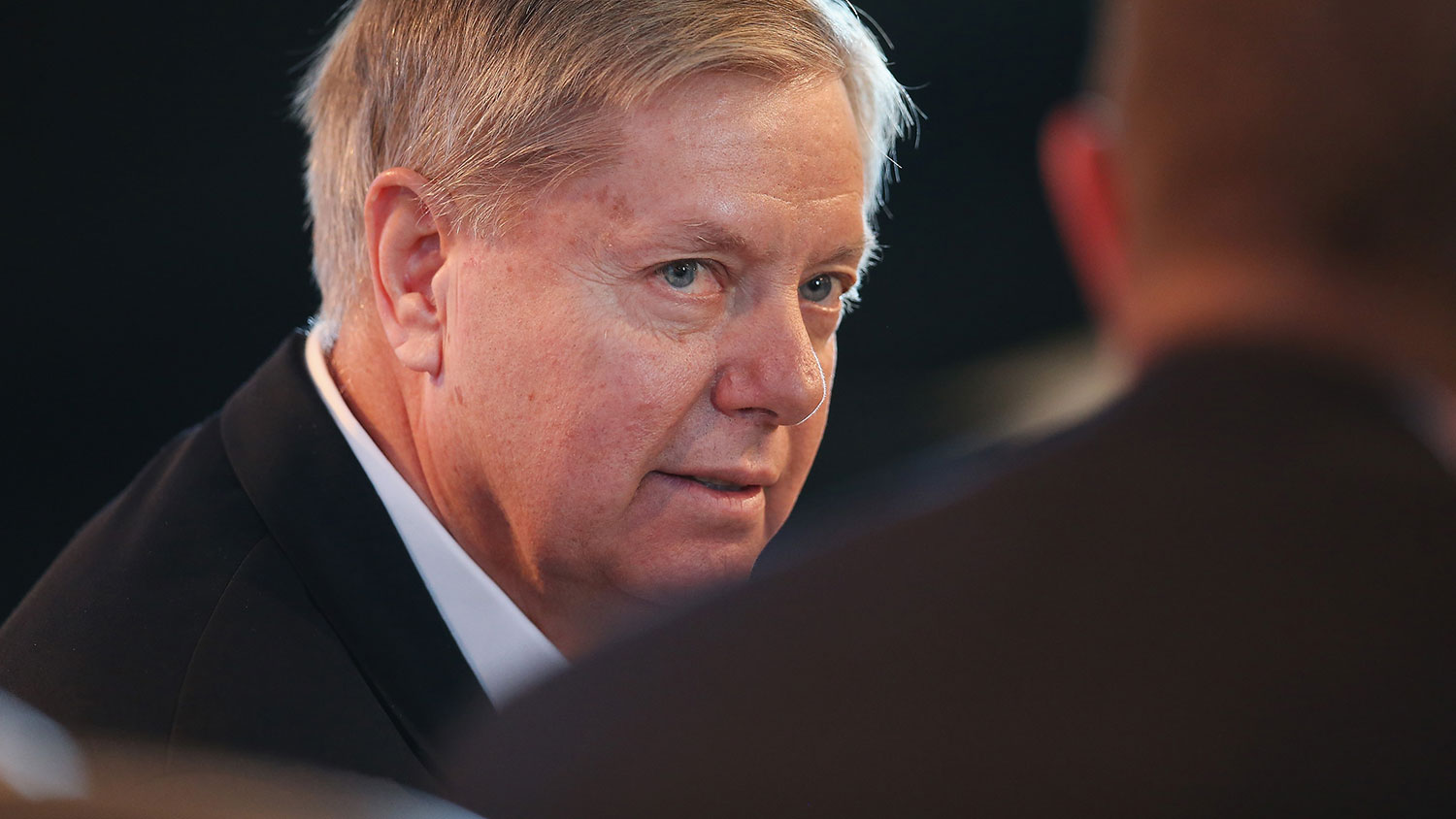 U.S. Senator Lindsey Graham (R-SC) fields questions from Bruce Rastetter at the Iowa Ag Summit on March 7, 2015 in Des Moines, Iowa.
