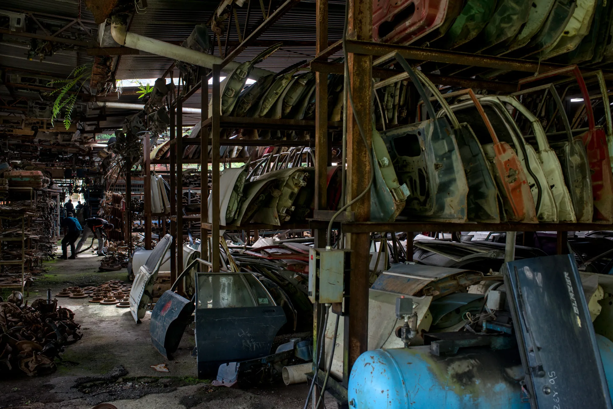 Car doors sit on shelves in Caracas.