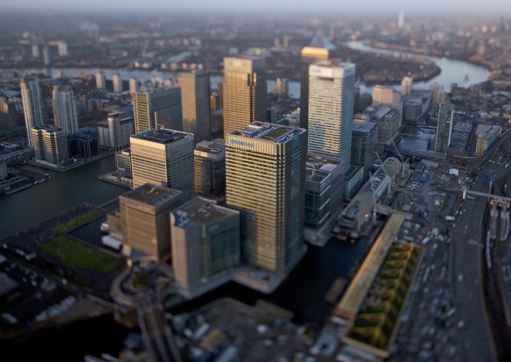 No. 1 Canada Square stands surrounded by the offices of global financial institutions, including HSBC Holdings Plc, Citigroup Inc., JPMorgan Chase &amp; Co., and Barclays Plc, in this aerial photograph taken with a tilt-shift lens looking west along the River Thames towards the City of London from the Canary Wharf business and shopping district in London in London, U.K., on Thursday, Dec. 19, 2013. The pound approached a two-year high versus the dollar after Bank of England policy maker Andrew Bailey said the central bank may take steps to prevent U.K. house prices from rising too quickly.
