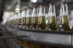 Bottles of beer move along a conveyor belt in Guadalajara, Mexico.