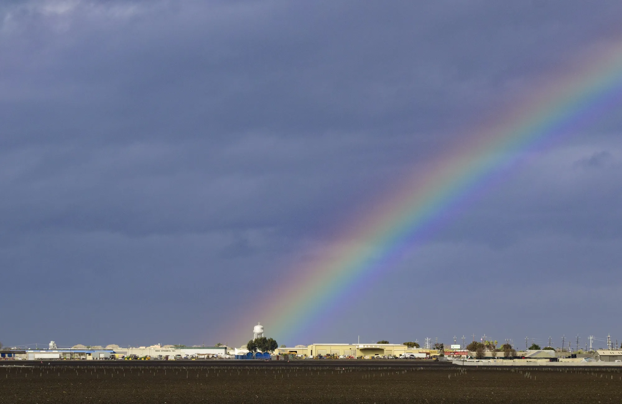 A rainbow behind a water tower during rain storms in Salinas, California on Jan. 13, 2023.