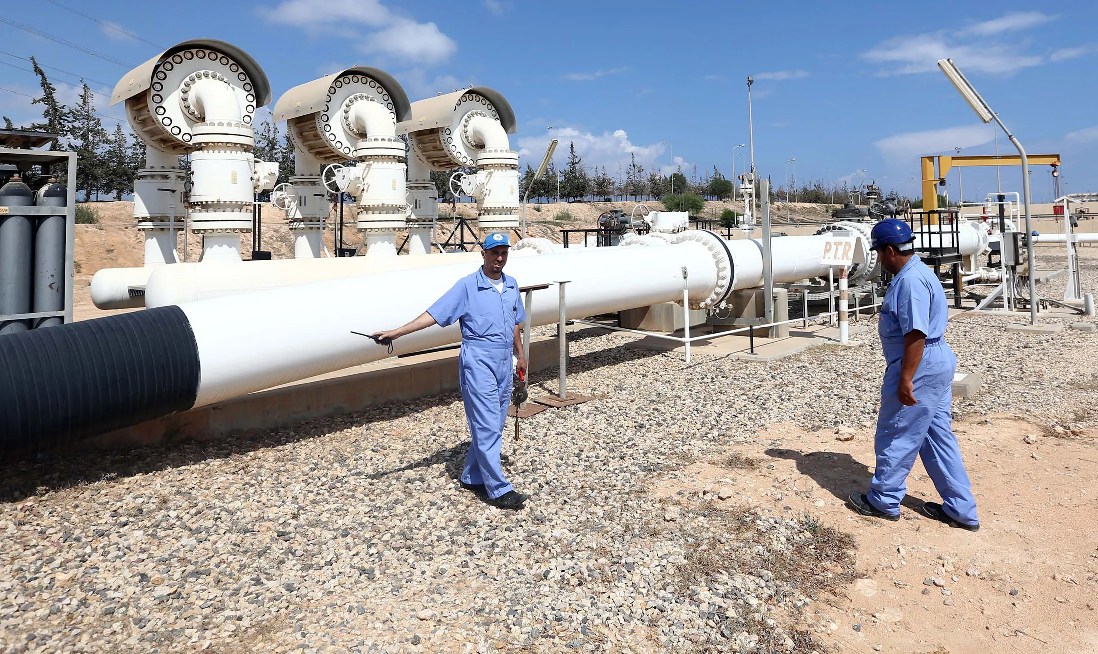 Libyan oil workers at the the Zawiya oil installation.
