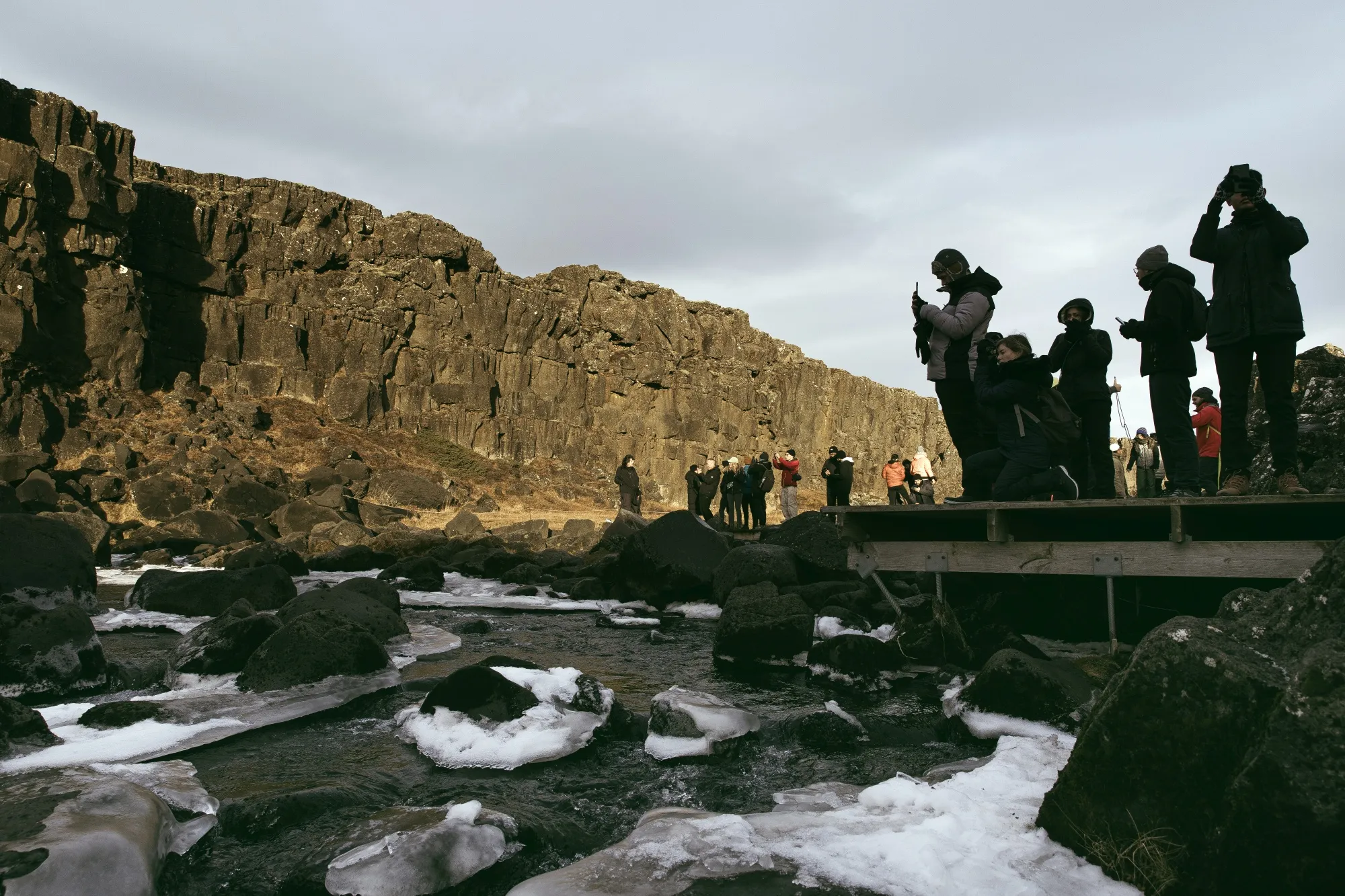 Tourists at Thingvellir National Park examine the Mid-Atlantic Ridge that runs through Iceland, on Nov. 12.