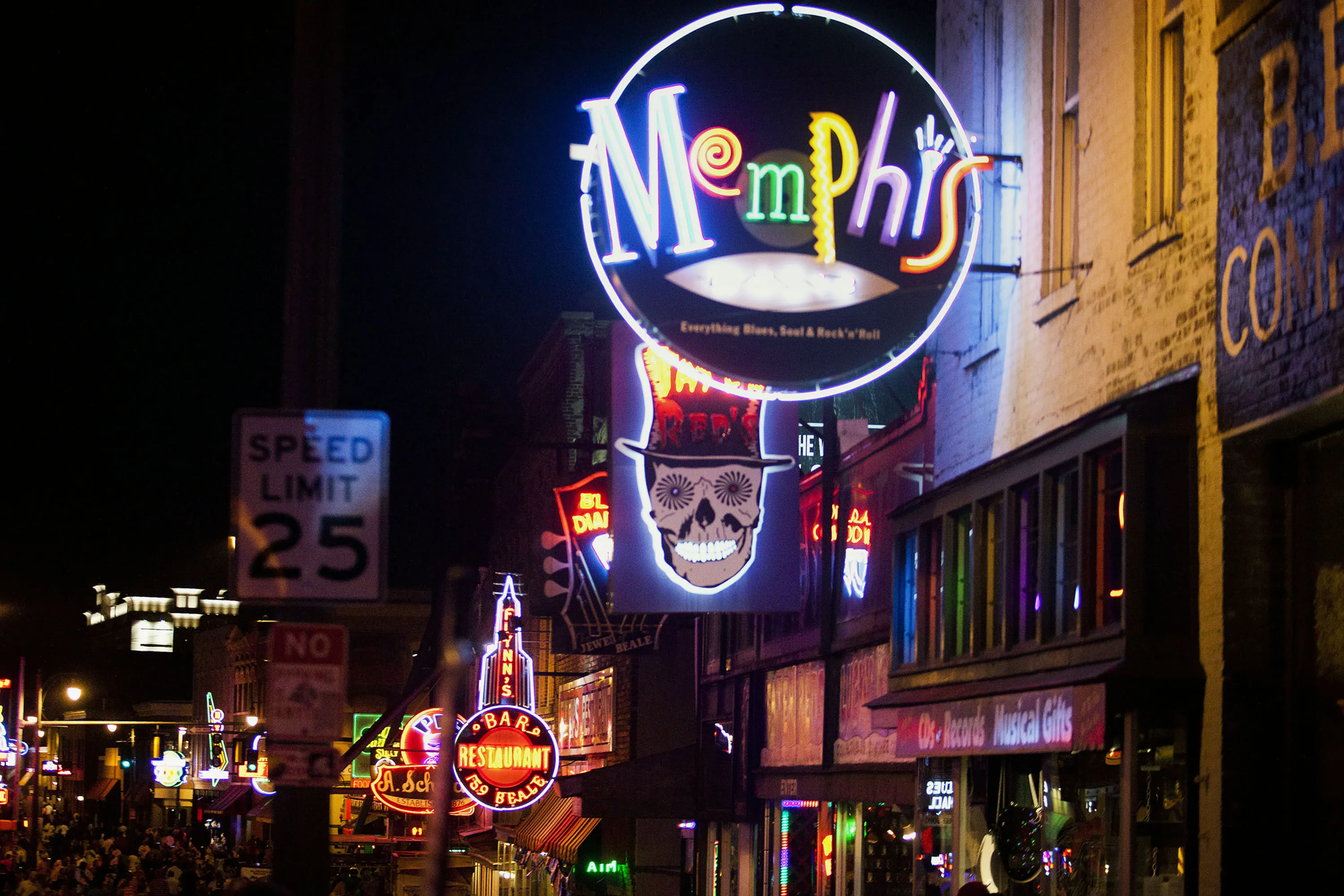 Neon signs for bars and clubs light up Beale Street at night in downtown Memphis.&nbsp;
