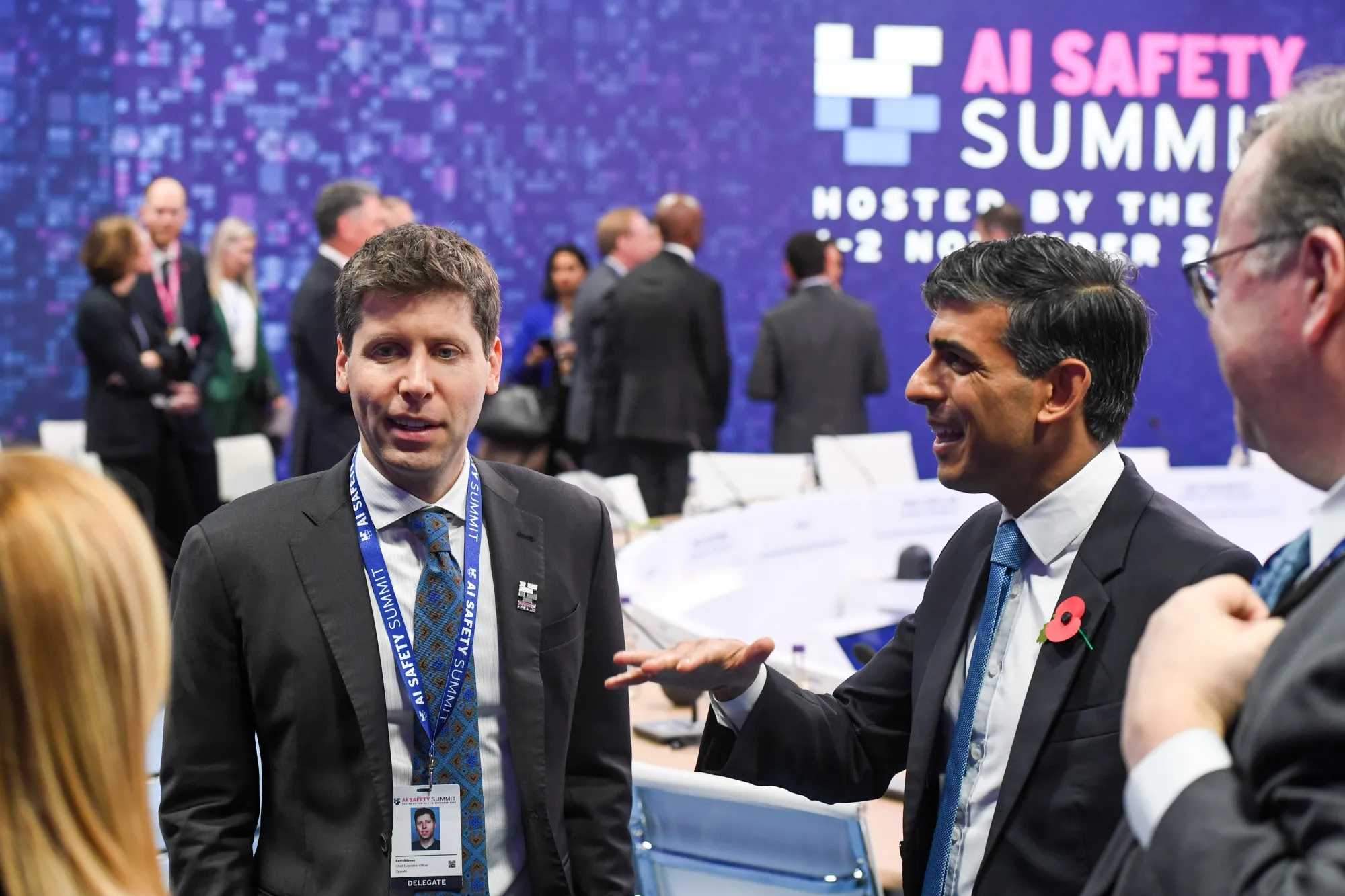 Sam Altman, OpenAI co-founder, left.