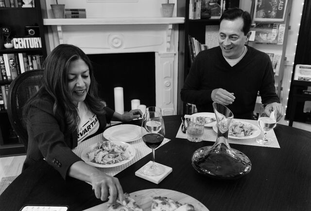 Murvartian and her husband sit at the dinner table to eat. 