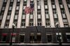 An American flag flies outside a Bank of America Corp. building in Chicago, Illinois, U.S., on Sunday, July 9, 2017. Bank Of America Corp. is scheduled to release earnings figures on July 18.