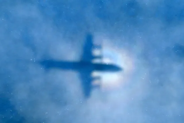 The shadow of a Royal New Zealand Air Force P3 Orion aircraft as it searches for the missing Malaysia Airlines flight