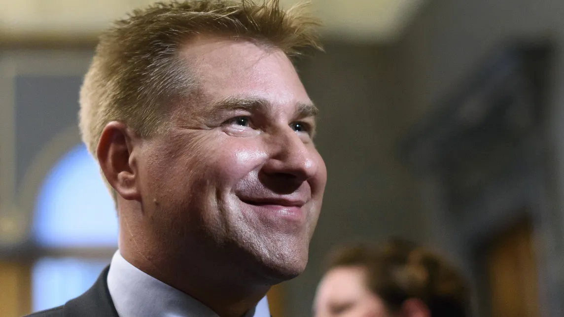 Swiss People's Party SVP President Toni Brunner smiles at the house of Parliament.
